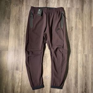 nike sportswear tech woven track pants